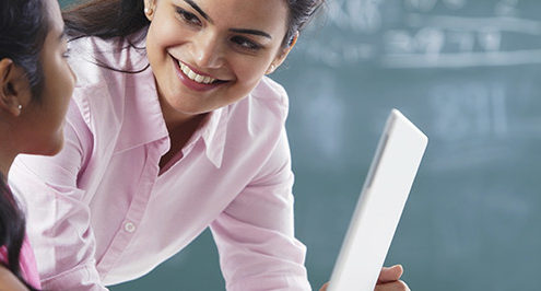 female teacher and female student smile because of school security technology