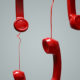 red phones hanging in the air emergency communication plan
